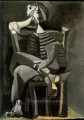 Man seated knitting stripes 1939 cubism Pablo Picasso